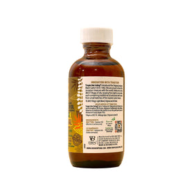 Tropic Isle Living bottle beside coin to show 59ml scale for easy reference