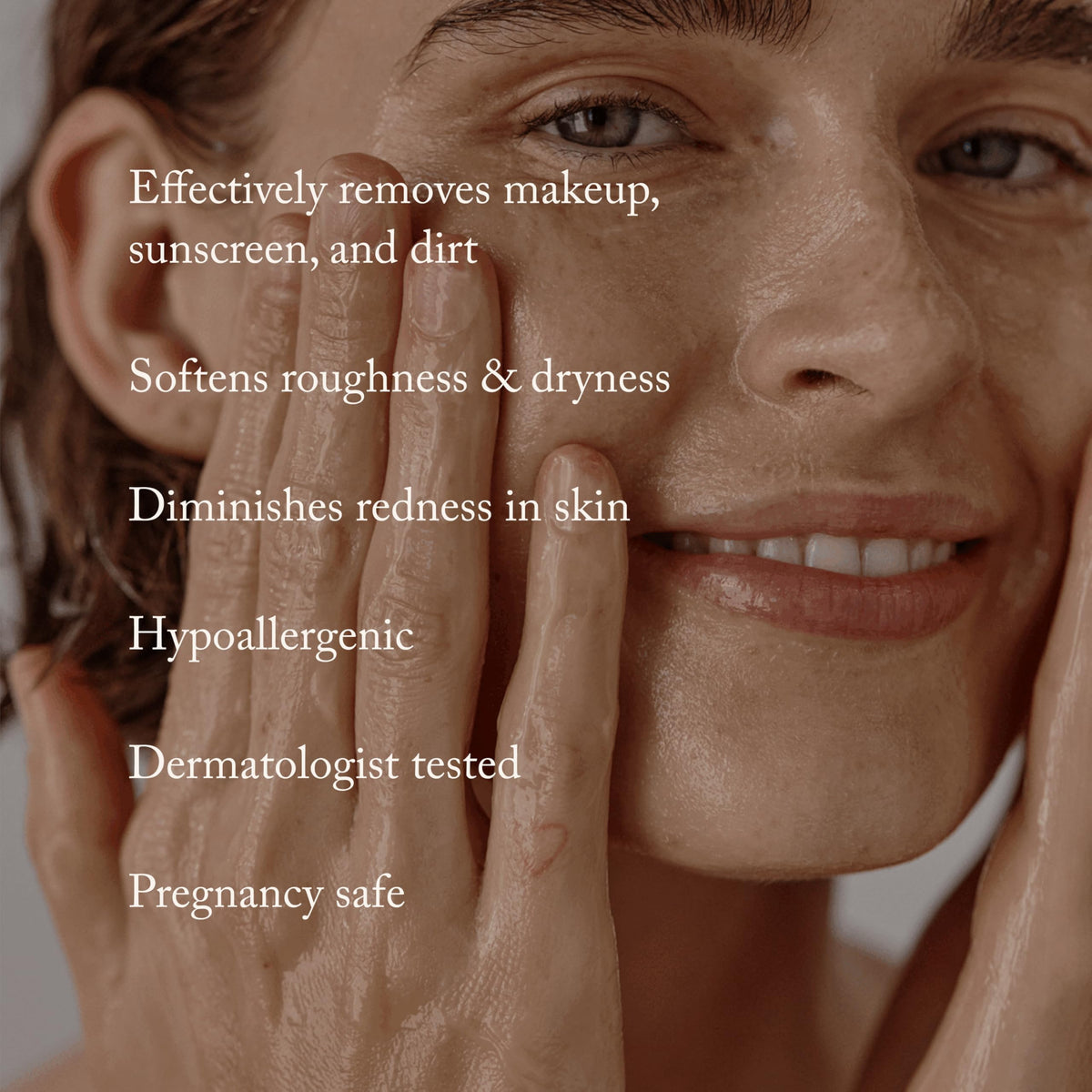 True Botanicals balm transforming to oil on fingertips to dissolve makeup and sunscreen quickly