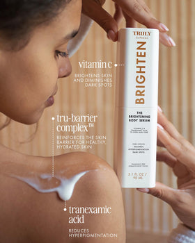Truly applying serum to shoulder to fade dark spots and even tone