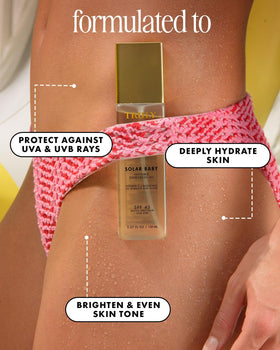 Truly Solar Baby oil texture drop highlighting quick-absorbing hydration