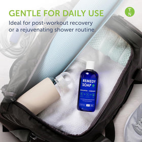 Truremedy Naturals 12oz bottle beside everyday items showing travel-friendly size benefit