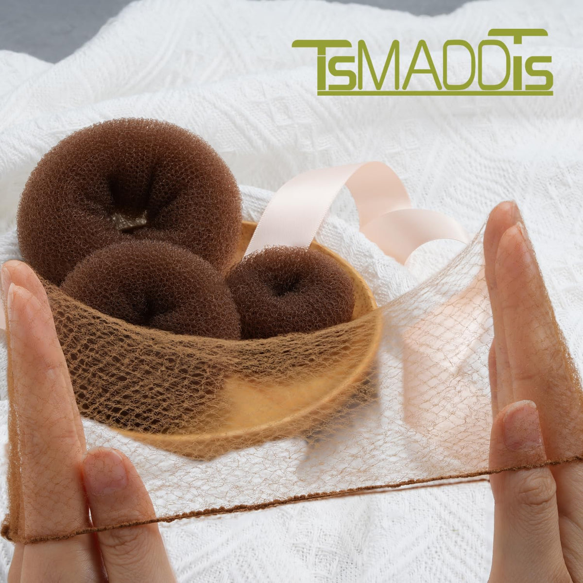 TsMADDTs finished bun on model illustrating polished stage-ready style