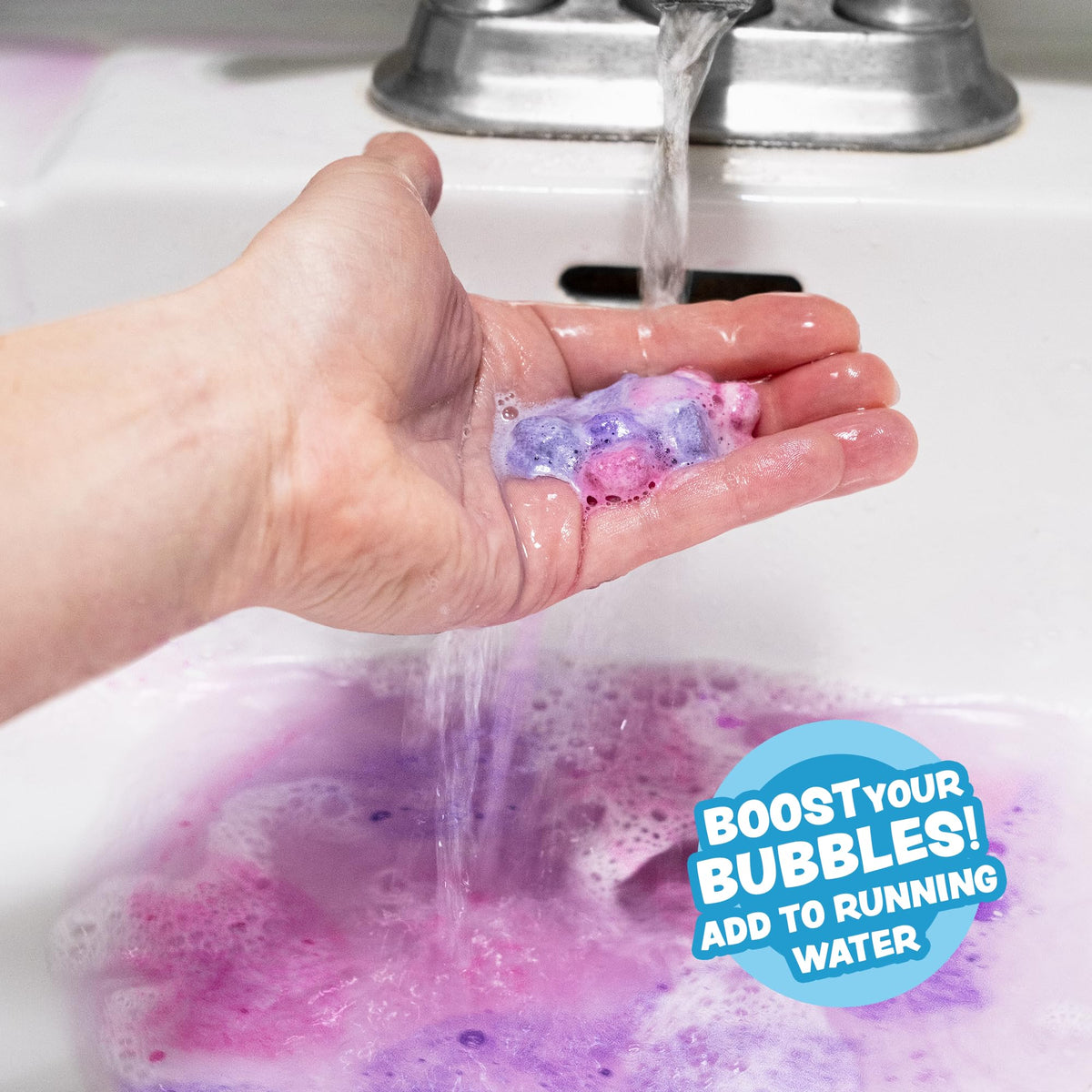 Child smiling in bathtub enjoying Tub Works Lil' Bursts for playful, sensory bath time