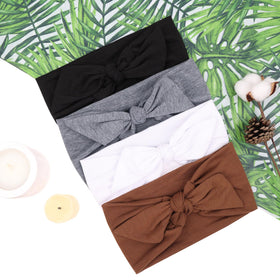TuTive four headbands laid flat displaying color variations and styling options for daily wear