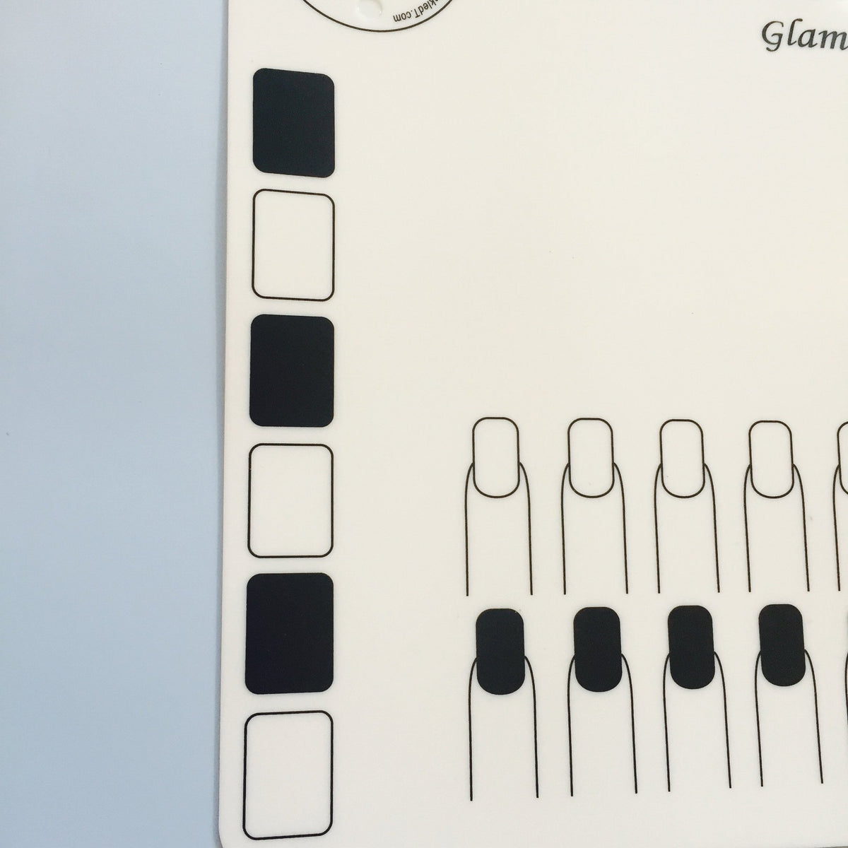 Twinkled T mat beside ruler highlighting 16 by 12 inch size and thickness
