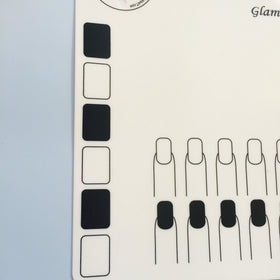 Twinkled T mat beside ruler highlighting 16 by 12 inch size and thickness