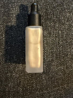 Typology Glow Drops mixed with moisturizer demonstrating blendability