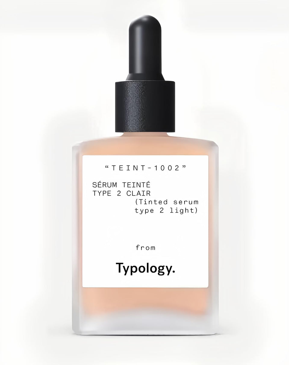 Typology tinted serum front vial showing label and pump for easy application benefit