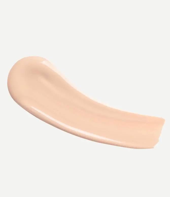Typology tinted serum texture drop closeup highlighting lightweight finish and blendability
