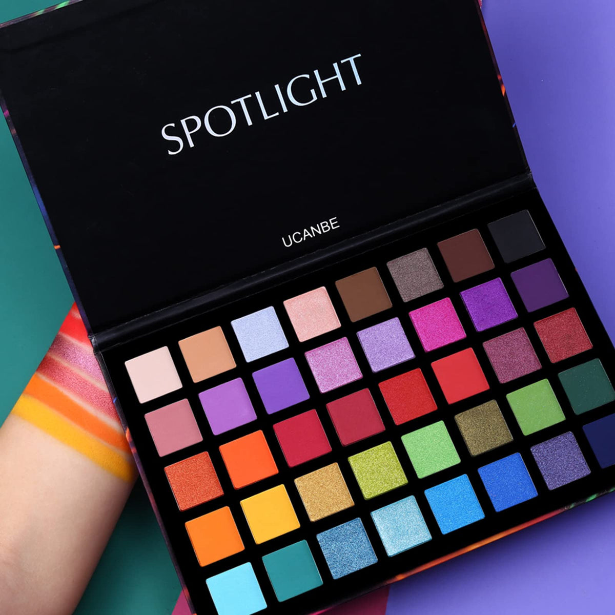 UCANBE arm swatches of matte and shimmer shades showing blendability