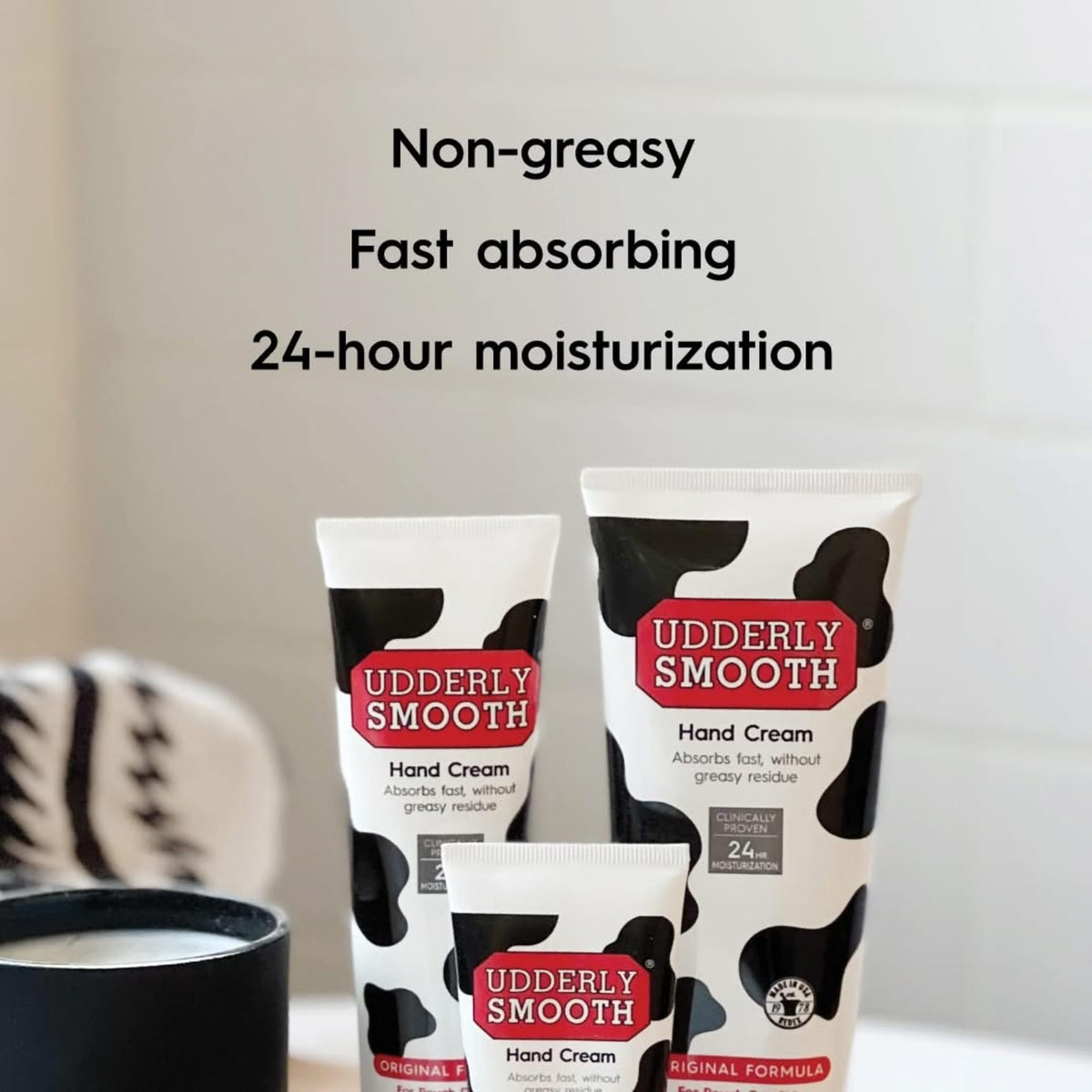 Udderly Smooth body cream applied to elbow to smooth and soften rough skin