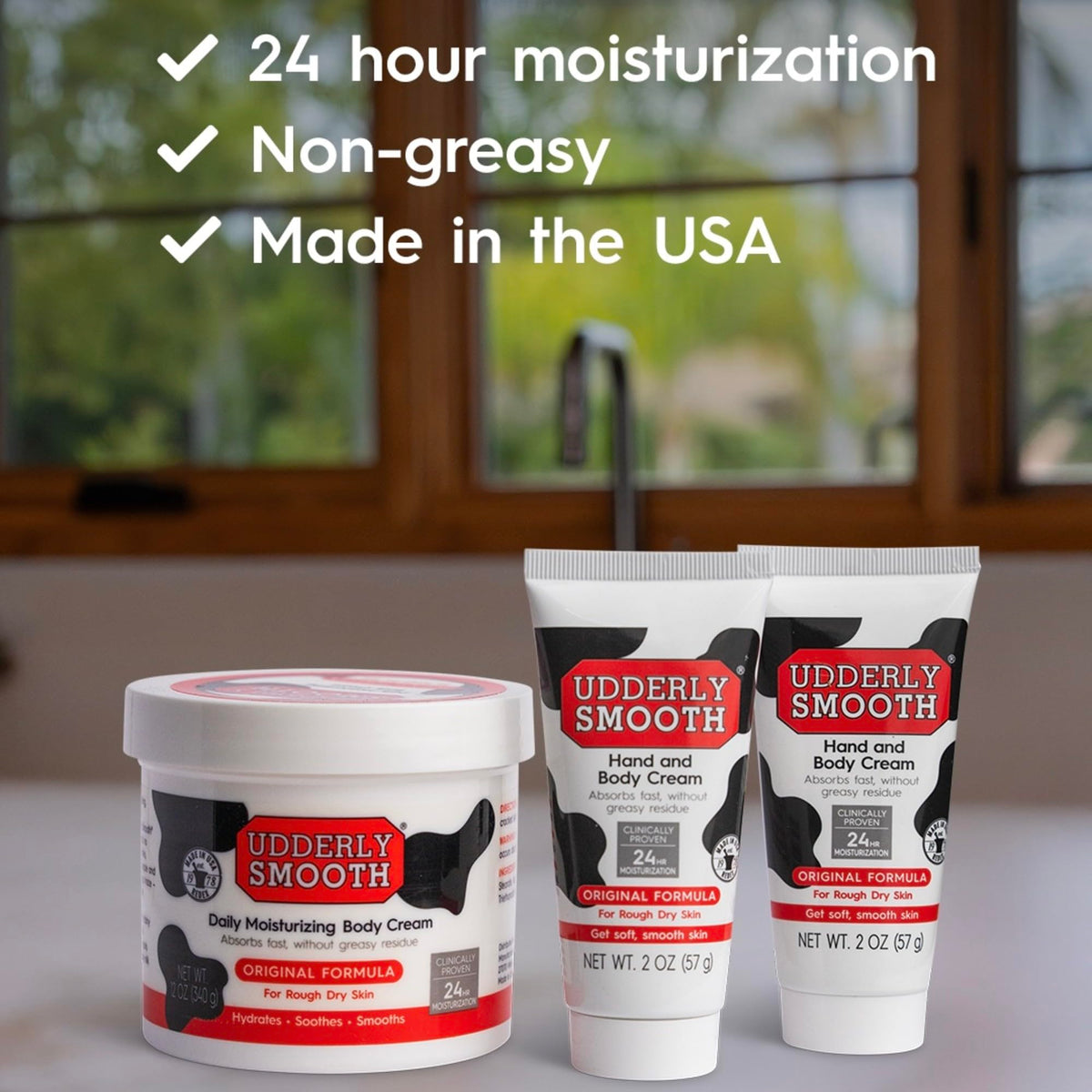 Udderly Smooth hand cream 2 oz close-up tube highlighting fast-absorbing formula benefit