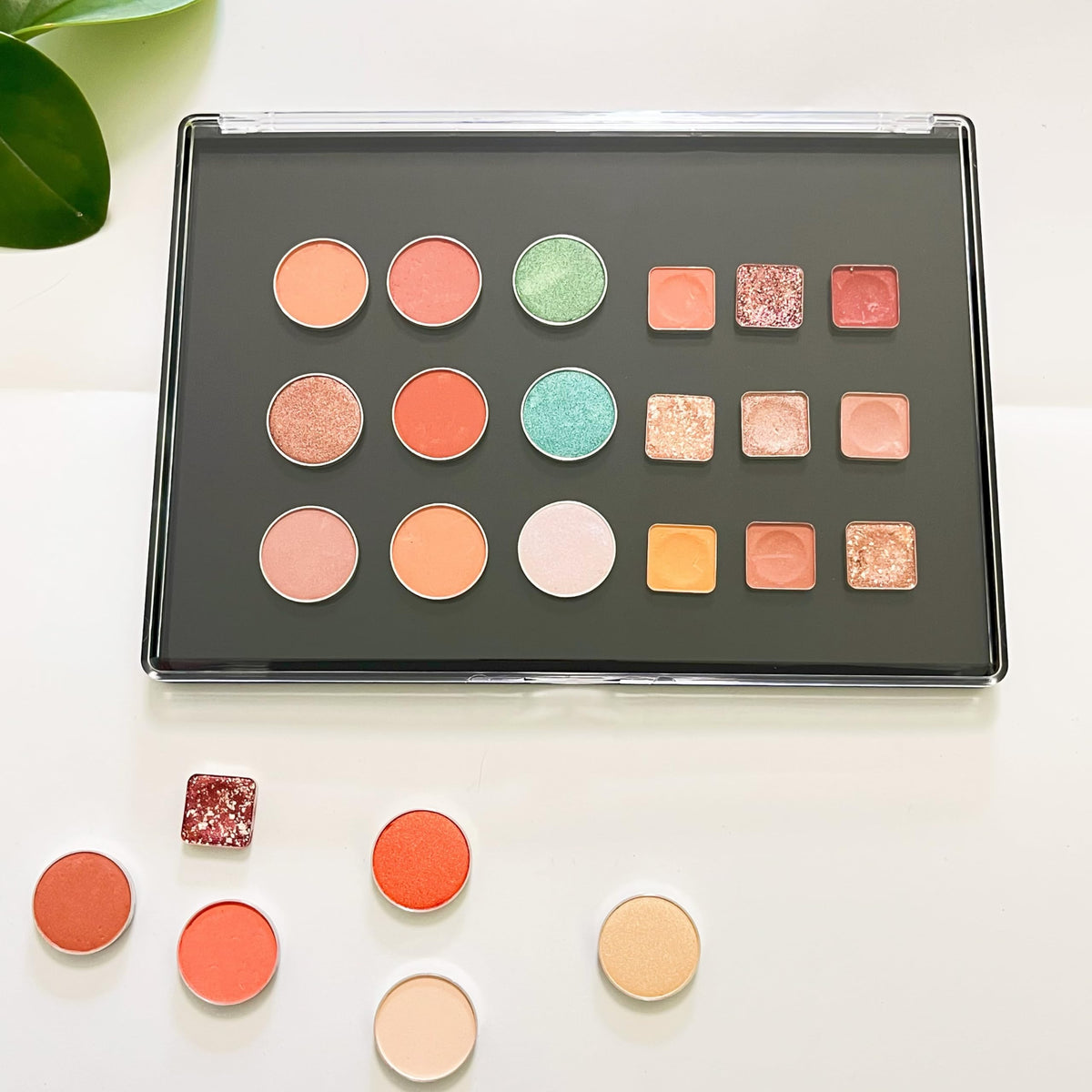 Two UDTIP palettes stacked for travel to save space and protect makeup