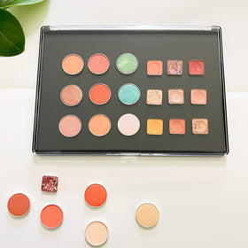 Two UDTIP palettes stacked for travel to save space and protect makeup