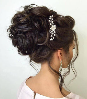 ULTIMUTE bridal lifestyle shot outdoors showing accessory enhancing wedding hairstyle
