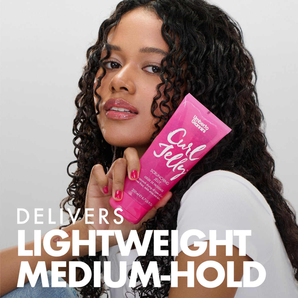 Umberto Giannini dolloping jelly into hands for even curl application
