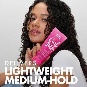 Umberto Giannini dolloping jelly into hands for even curl application