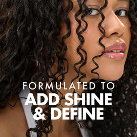 Umberto Giannini before and after images showing improved curl definition