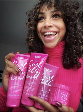 Umberto Giannini dry defined curls showing shine and frizz reduction