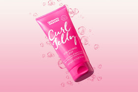 Bathroom shelf styled with Umberto Giannini Curl Jelly demonstrating daily styling routine