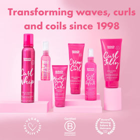 Umberto Giannini styled wavy hair lifestyle shot showing defined, shiny curls