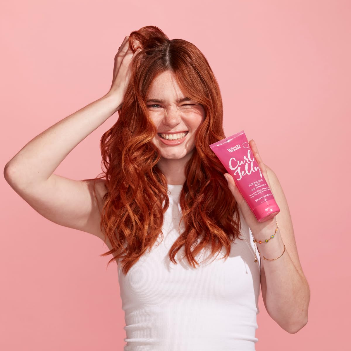 Umberto Giannini products held in hand for scale and travel-friendly convenience