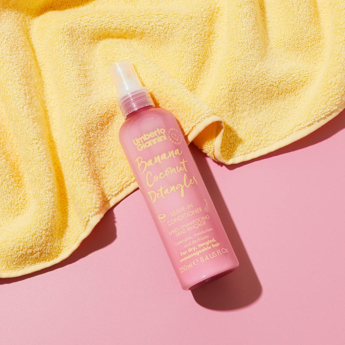 Umberto Giannini held in hand to show 8.4 fl oz scale and portability
