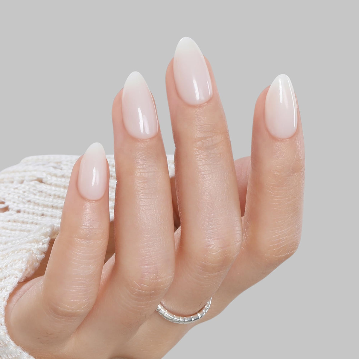 UNA GELLA close-up of glossy gel finish on a tip, showcasing salon-quality shine