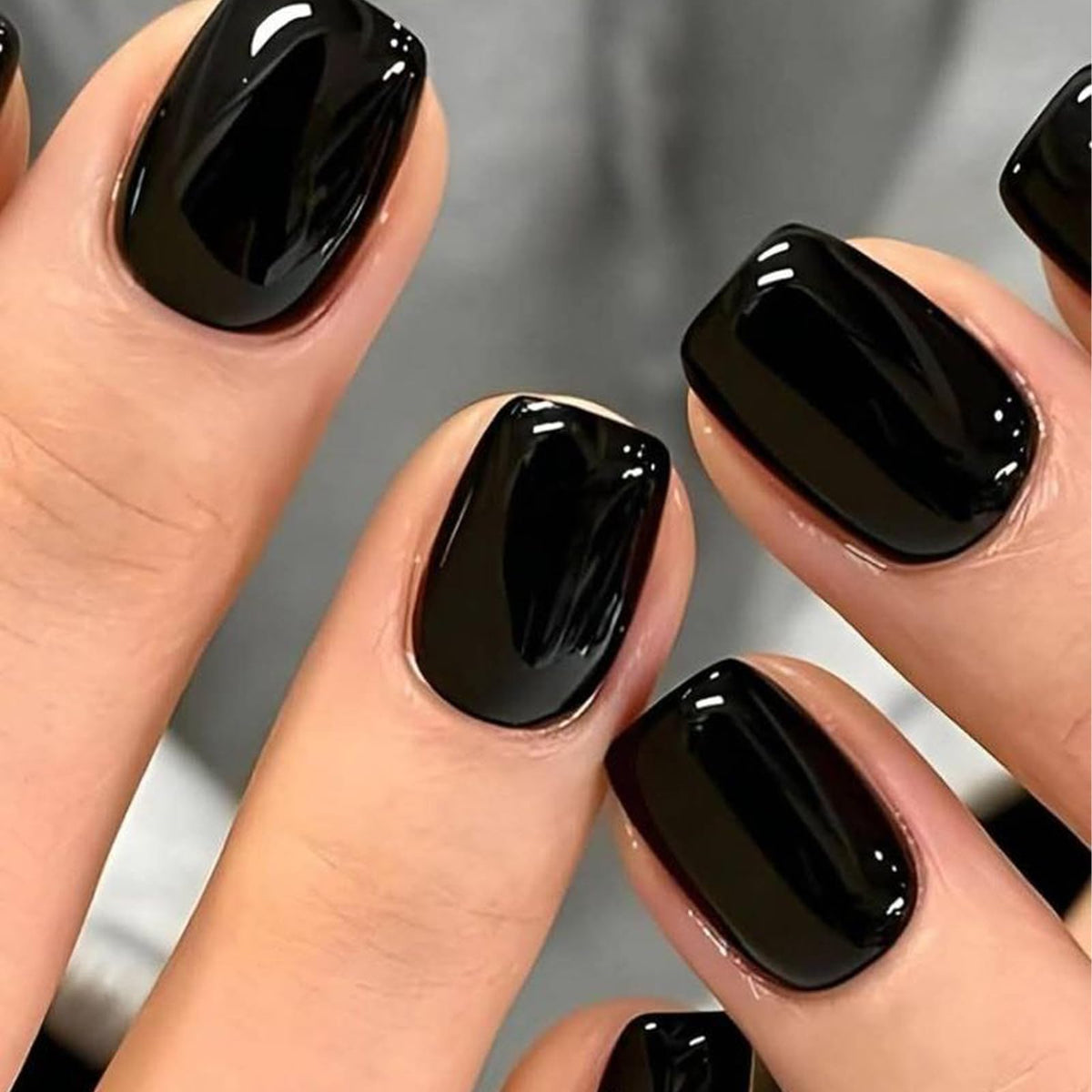 UNA GELLA front packaging showing glossy black nails and kit contents