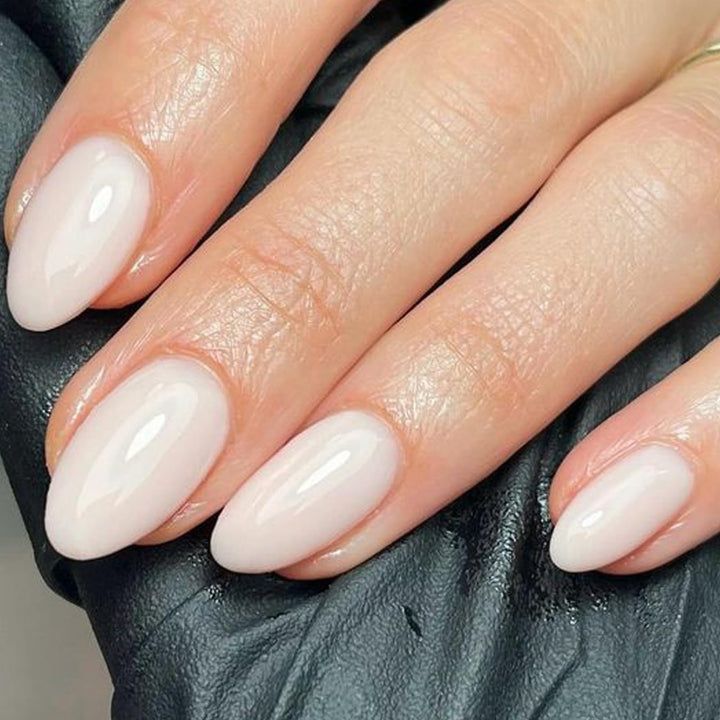 UNA GELLA front packaging showing milky white press-on nails and box, highlights complete kit