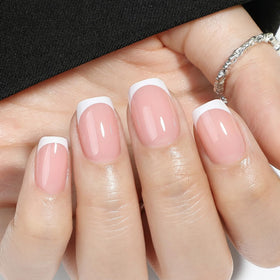 UNA GELLA hand applying press-on nail demonstrating fast application