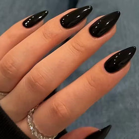 UNA GELLA front view showing medium almond glossy black nails, polished finish benefit