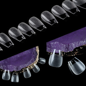 UNA GELLA clear tips grouped to show translucency and polish readiness