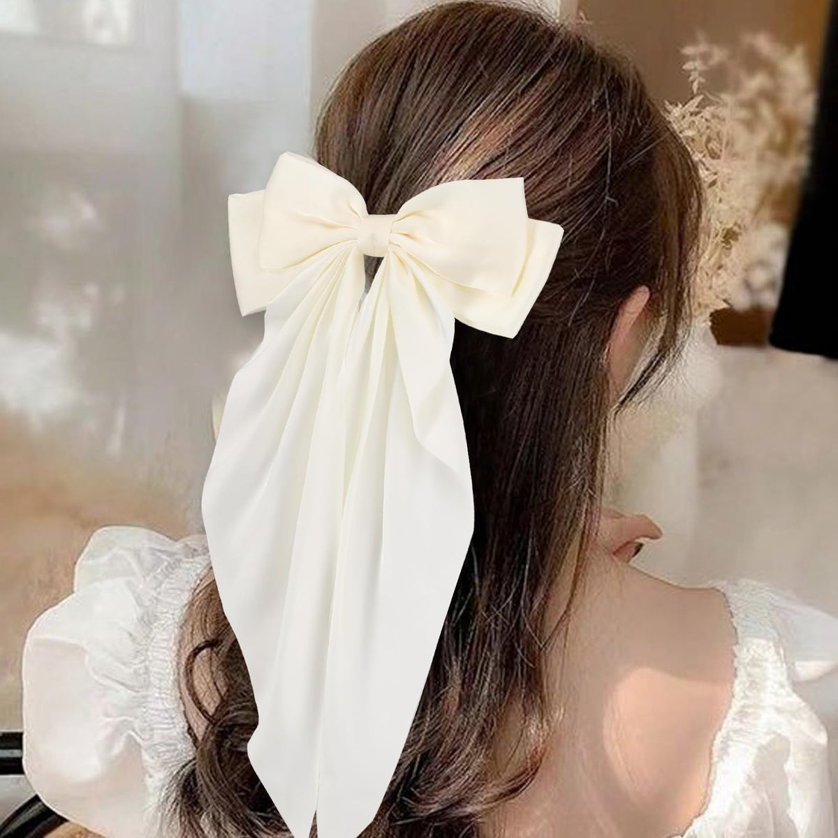 Unbednigt oversized bow clipped to ponytail adding instant volume and polish