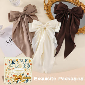Unbednigt bow secured over bun for elegant event-ready styling