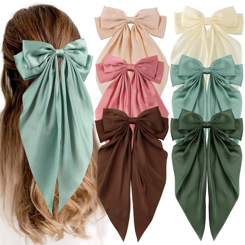 Unbednigt front view of six green oversized satin bows showing set value and gift appeal