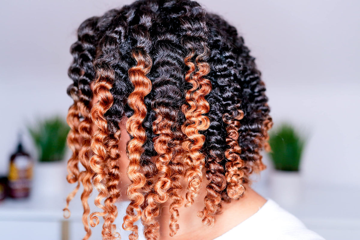 Uncle Funky's Daughter being applied to damp curls for easier detangling