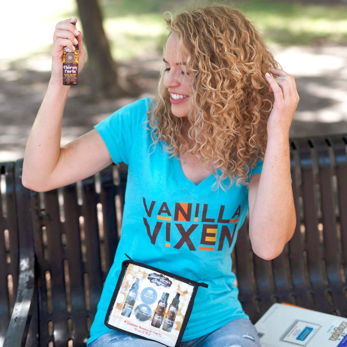 Uncle Funky's Daughter lifestyle photo of woman with defined curls showing hydrated results