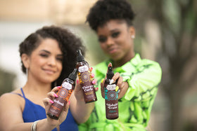 Uncle Funky's Daughter bottle next to ruler for scale showing portable size and travel-friendly benefit