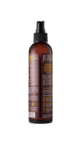 Uncle Funky's Daughter mist spraying onto hair delivering lightweight hydration and detangling benefits