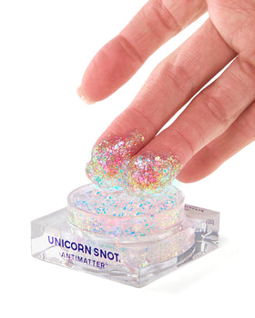 UNICORN SNOT applied on cheek showing purple to blue shift and radiant highlight