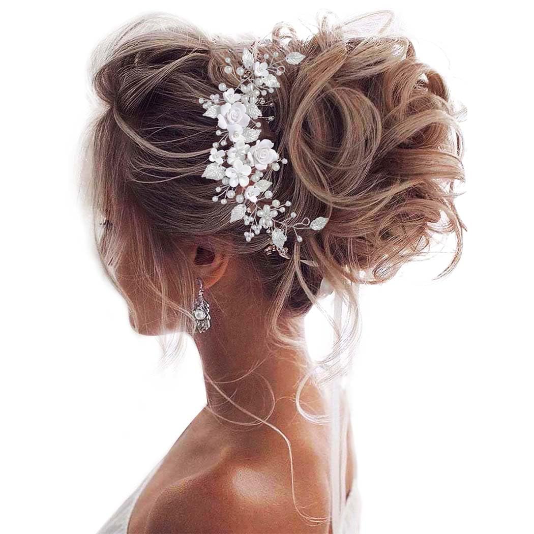 Unicra front view of silver headpiece showing floral arrangement and shine