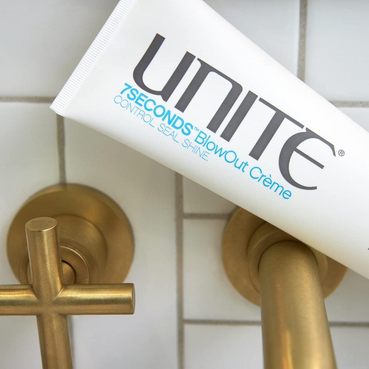 UNITE 7SECONDS cream texture on hand close-up showing lightweight glide and non-greasy feel
