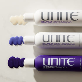 UNITE BLONDA 8oz bottle beside hand for size comparison and travel convenience