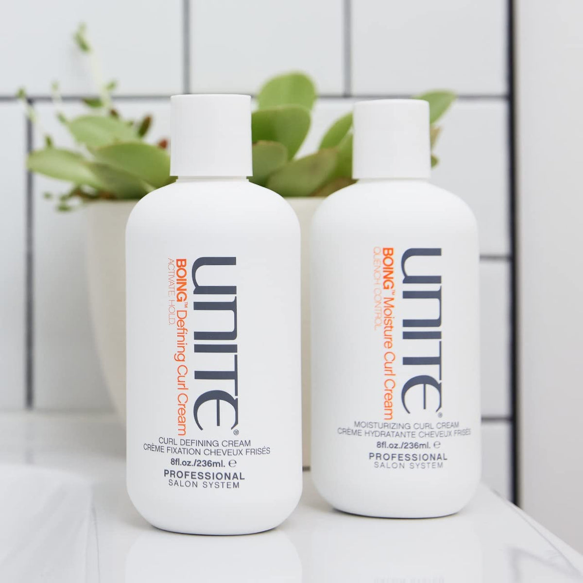 UNITE bottle in hand to show 8 fl oz scale and travel-friendly benefit