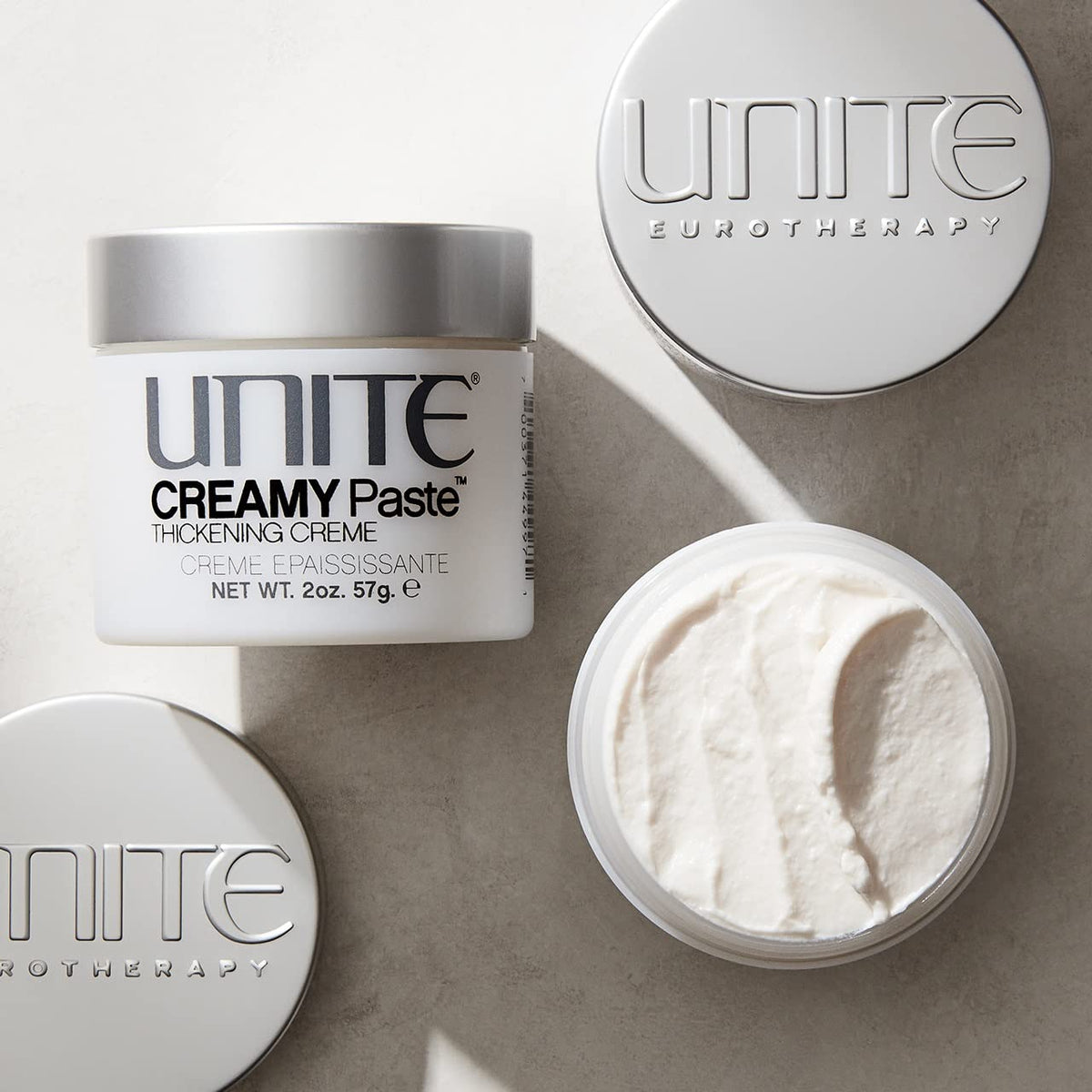 UNITE CREAMY Paste soft creamy texture close-up demonstrating pliability for styling control