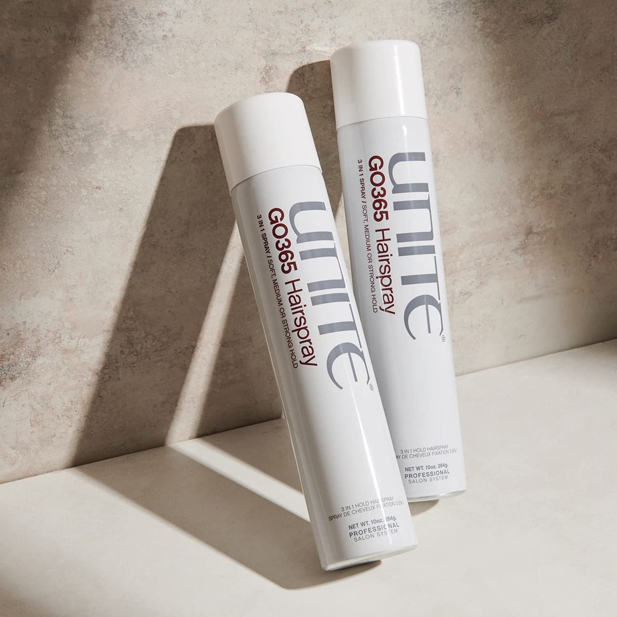 UNITE GO365 beside a ruler showing 10 oz size for travel and salon use
