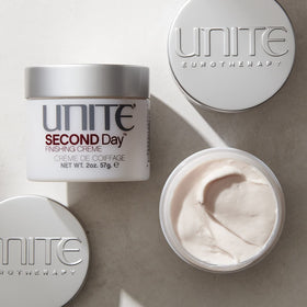 UNITE SECOND Day cream texture close-up showing lightweight formula and spreadability