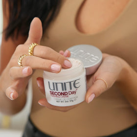UNITE SECOND Day next to a hand for size scale and portable travel benefit