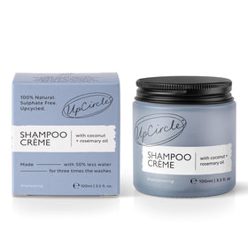 Person applying UpCircle shampoo crème to wet hair demonstrating easy lather and scalp massage